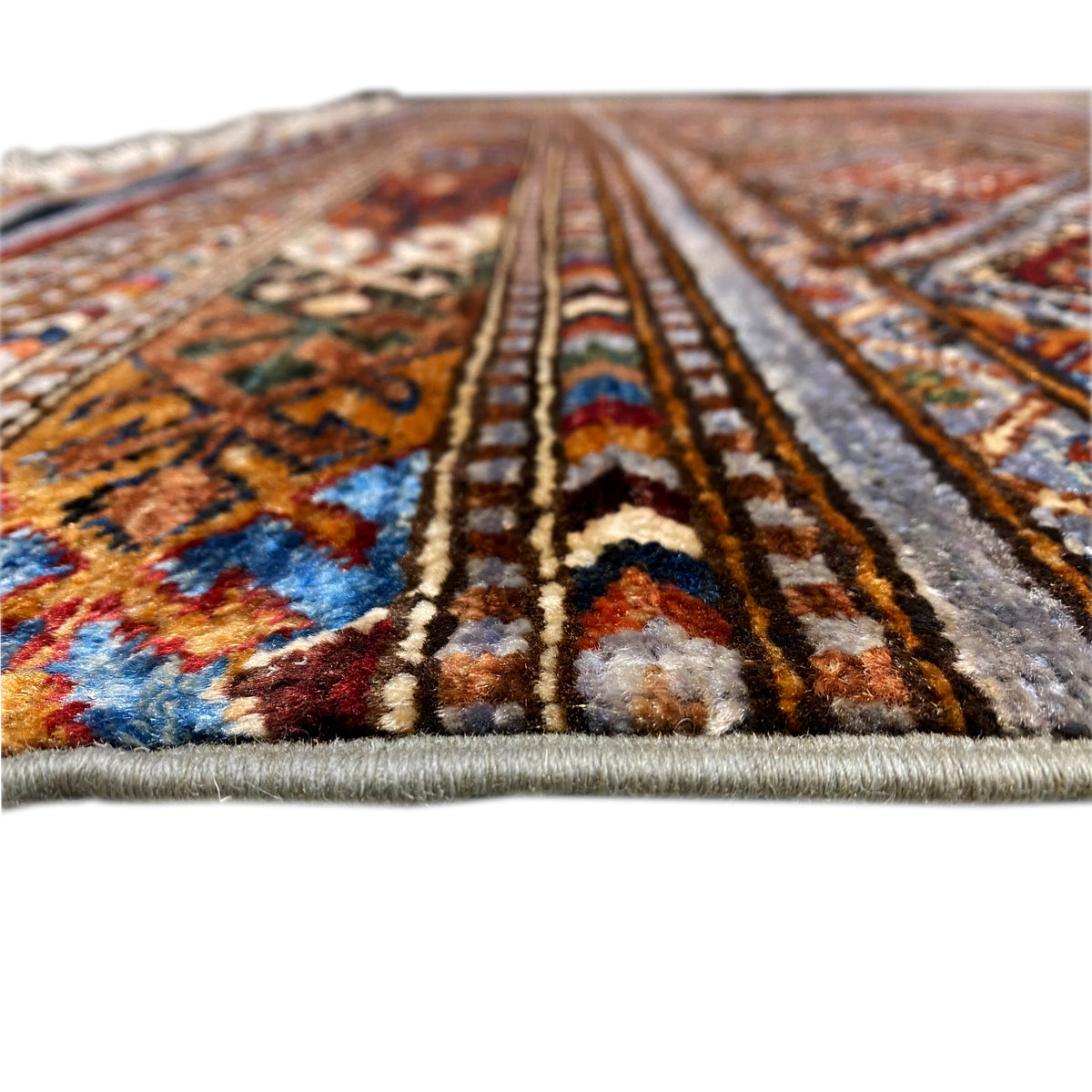 Khorjin rug with colorful sections, striped pattern, and plush-looking pile, fringes