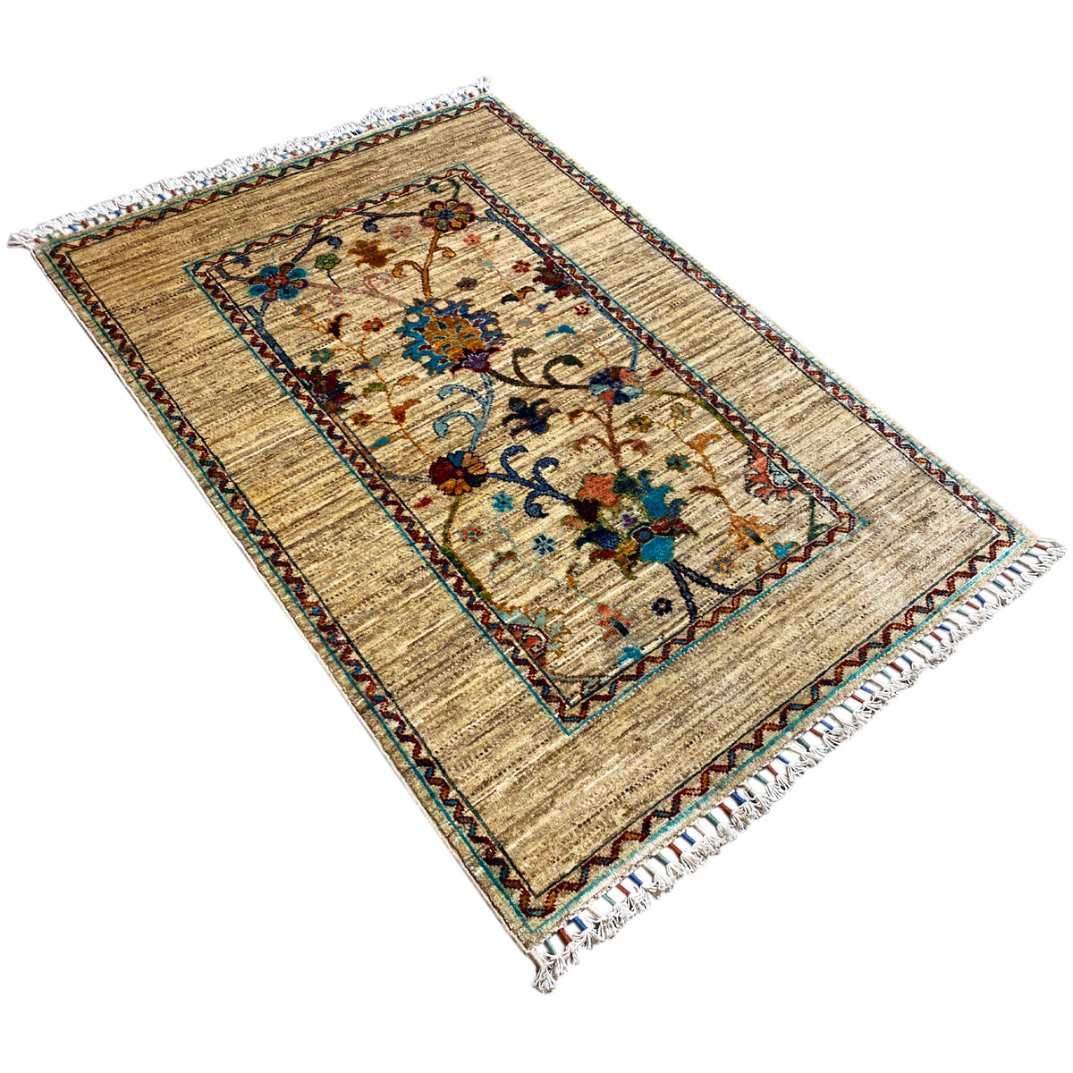Beige Khorjin rug, 126x85 cm, photographed at an angle: central floral medallion, border, fringes