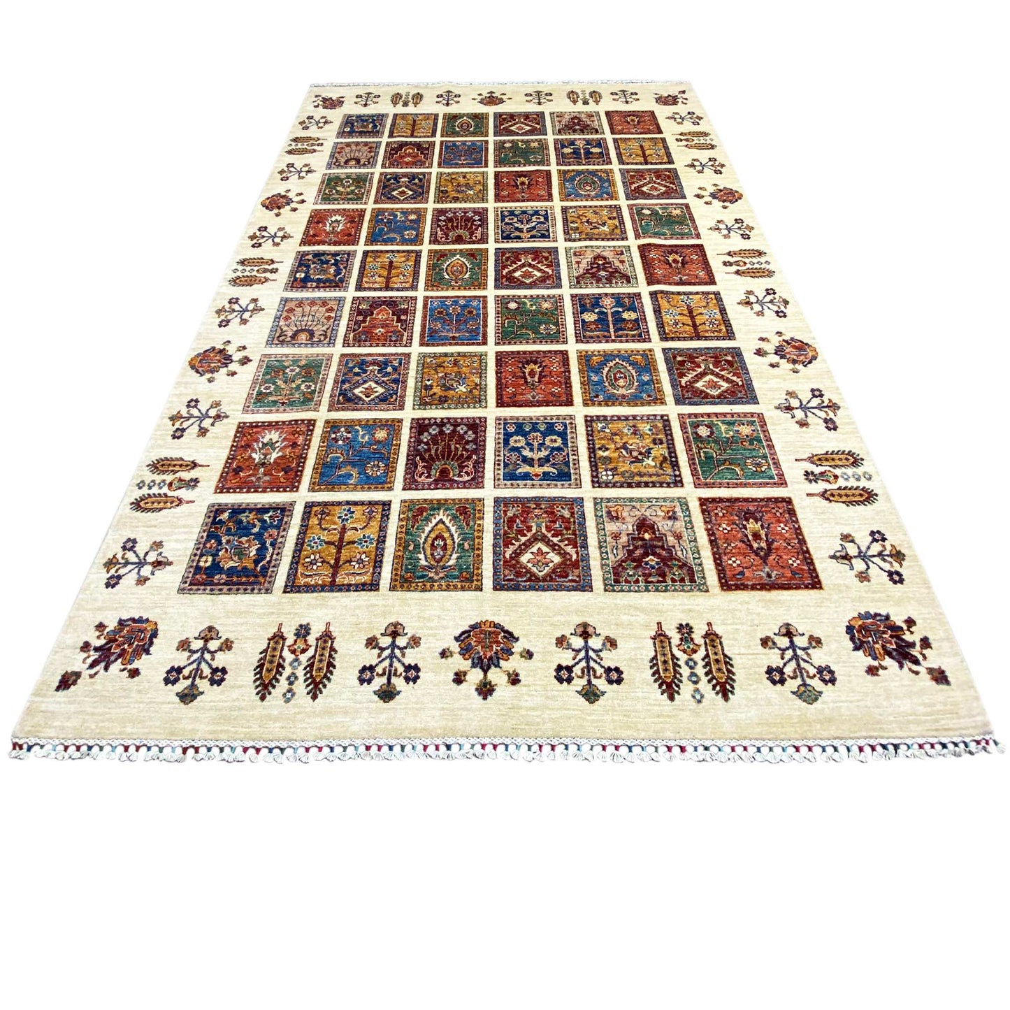 Wool rug with a square patchwork pattern in blue, red, and green on a light background