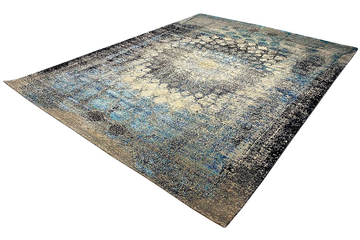 Rectangular designer rug viewed from above, abstract pattern in beige and blue
