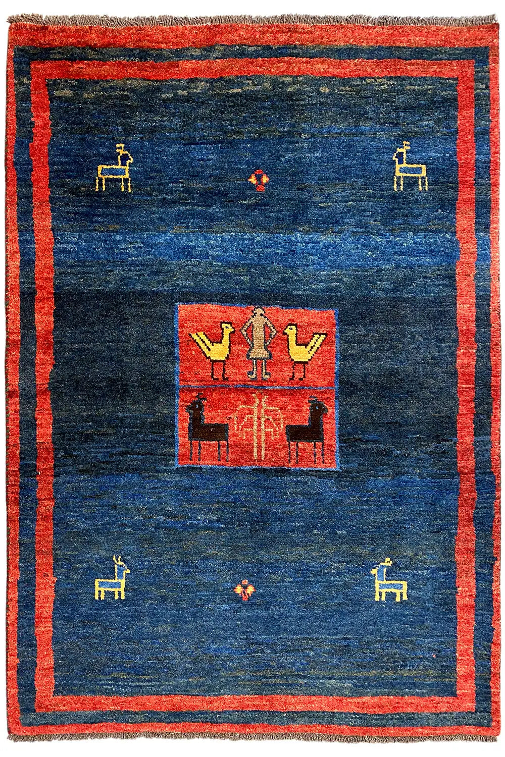 Gabbeh rug with a red border, dark blue background, and symmetrical central motif