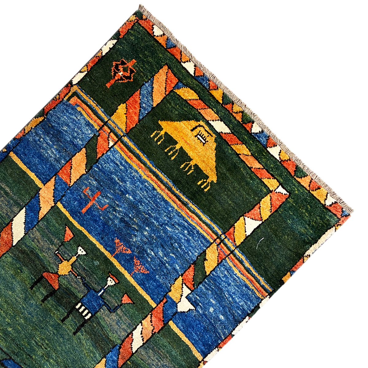 Gabbeh rug corner with a green field, blue striped border, and figurative motifs
