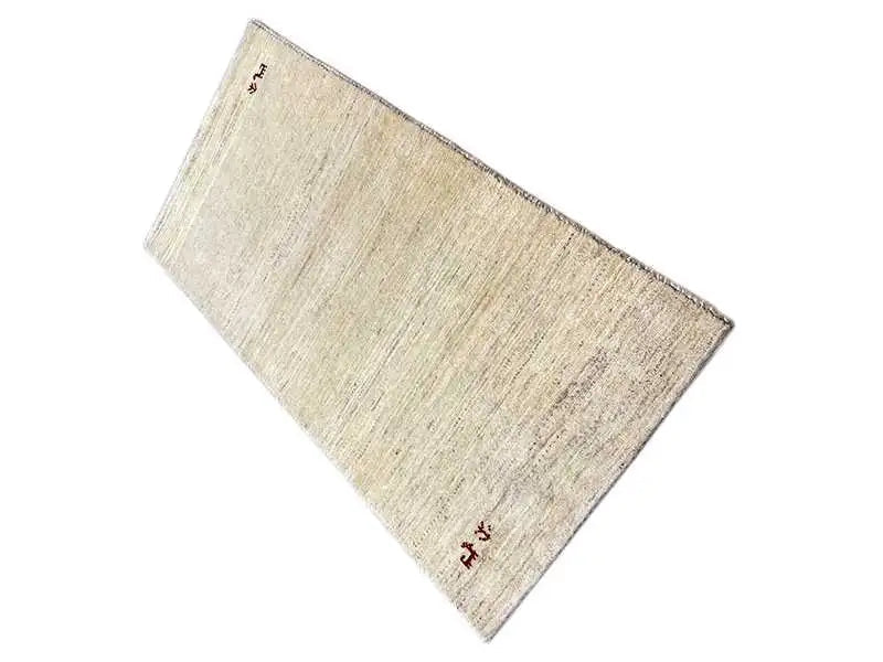Gabbeh rug 140x70 cm, light beige, positioned diagonally, with reddish-brown decorative motifs