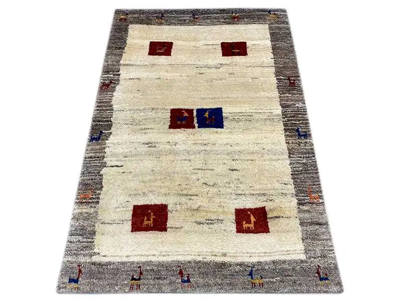 Gabbeh rug, rectangular, with a light beige color, gray border, and red/blue squares