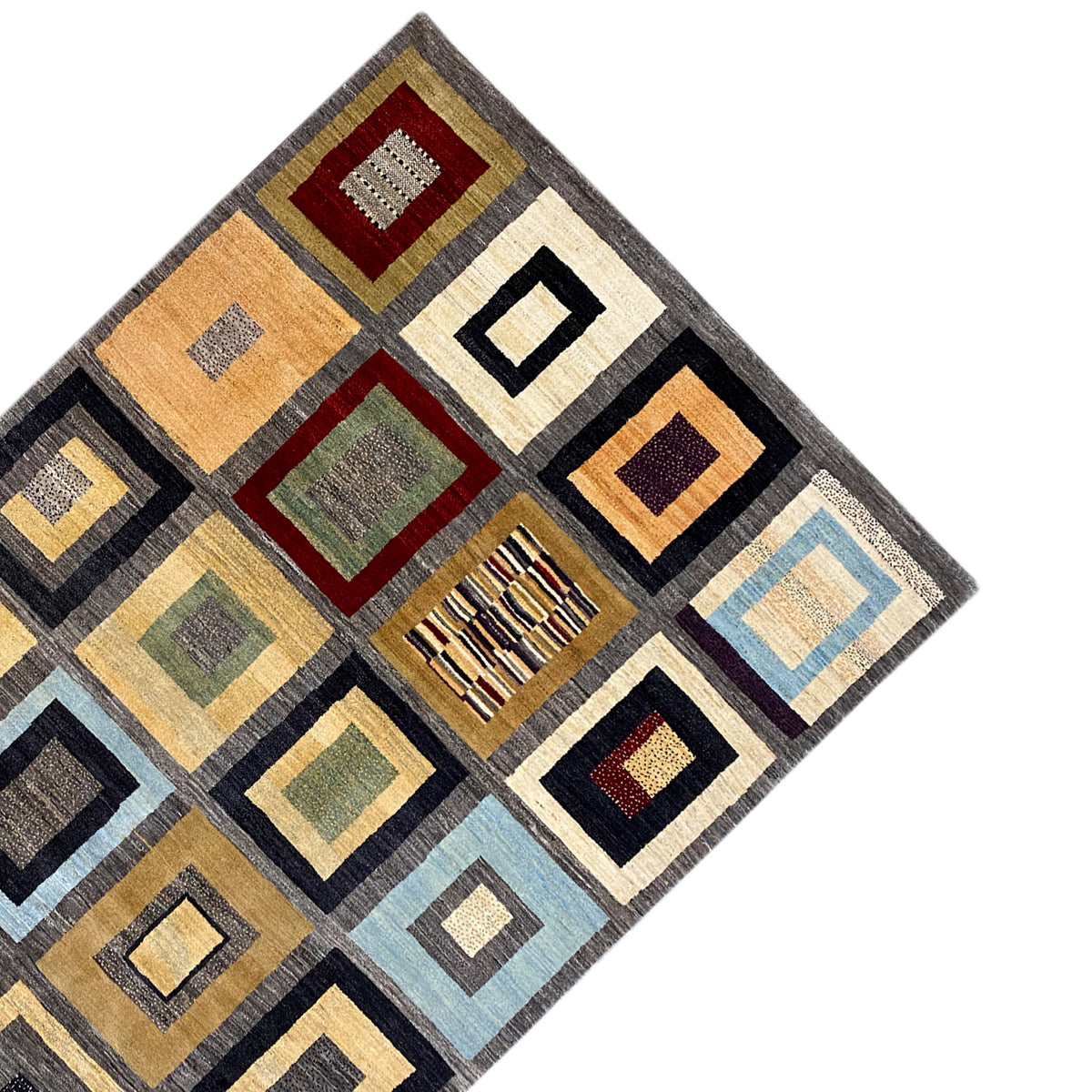 Rug corner with geometric squares in cream, ochre, black and turquoise