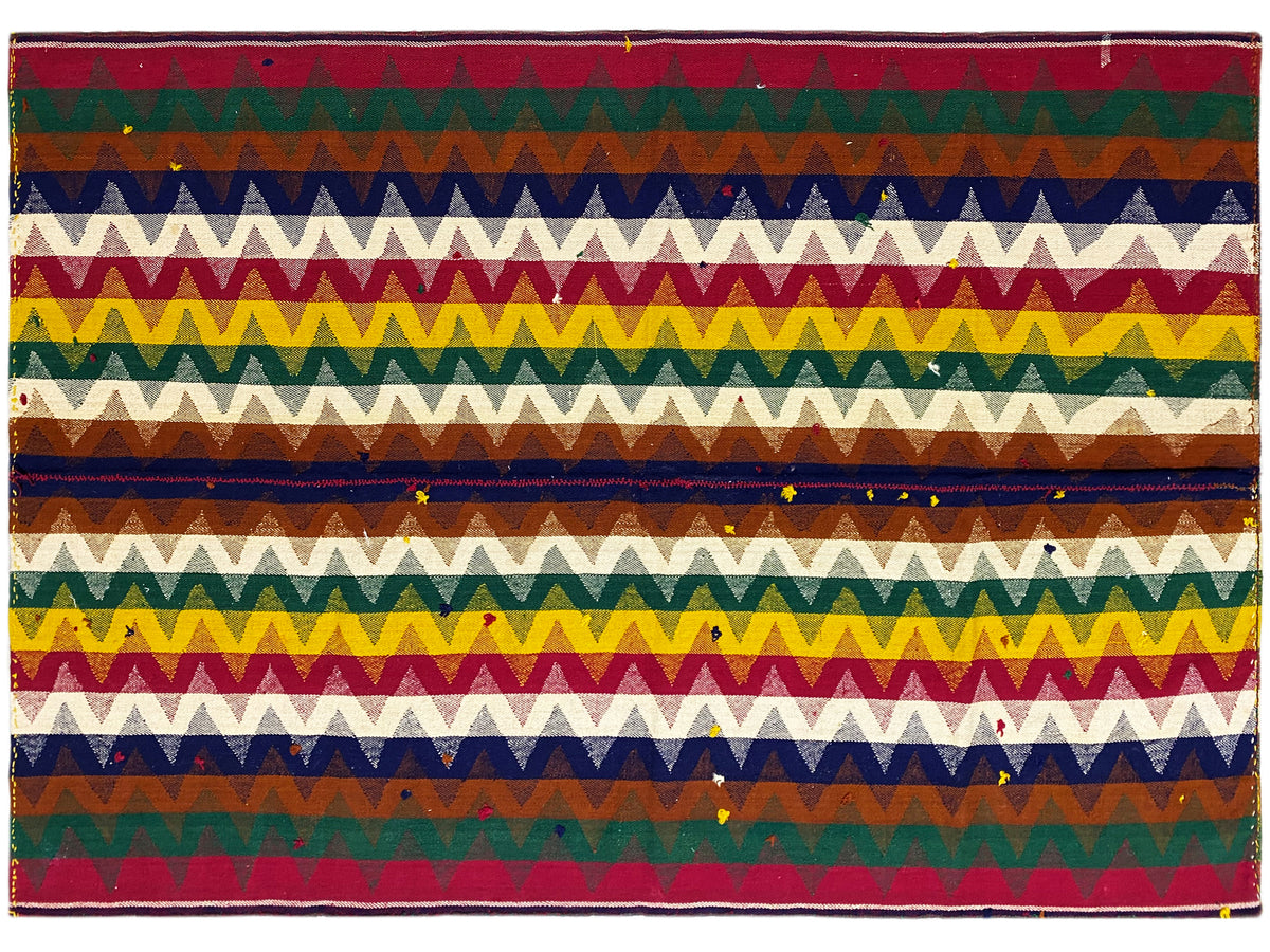 Jajim rug with a striped zigzag pattern in green, blue, red, and yellow, rectangular