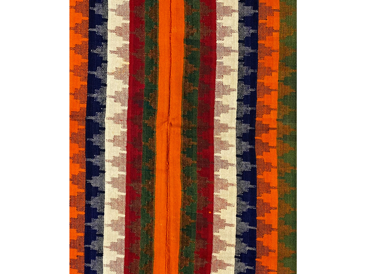 Carpet detail view: vertical color stripes with an orange central stripe