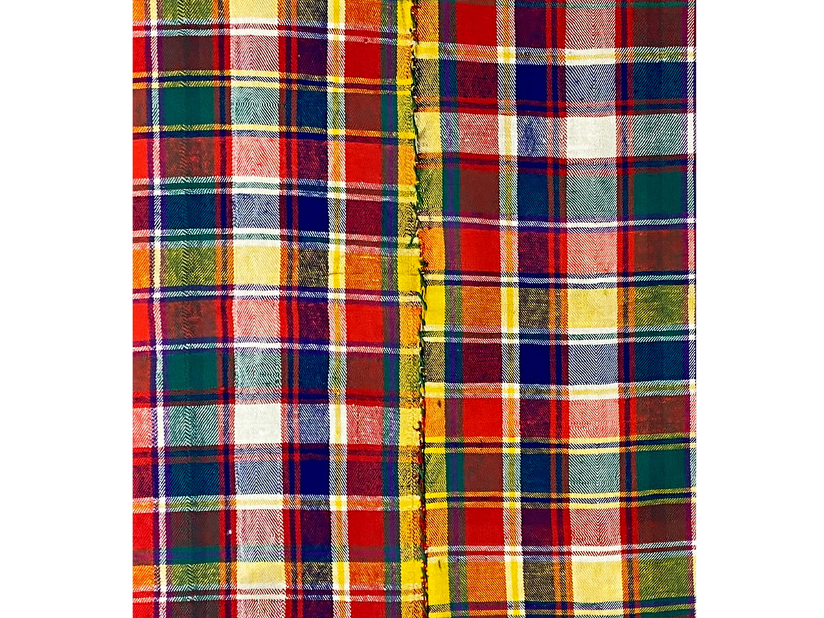 Jajim rug edge detail with fringe and multicolored checkered pattern
