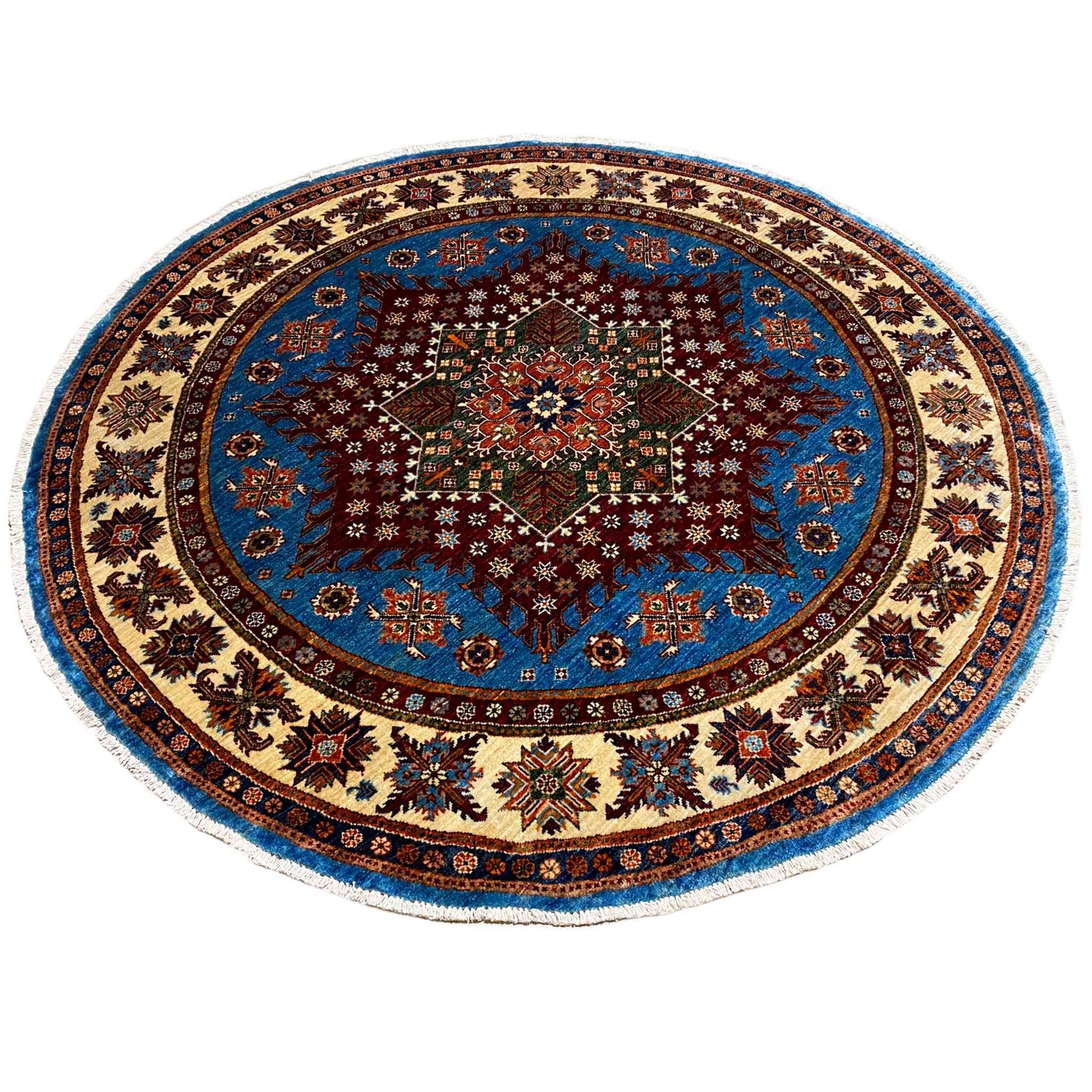Round rug with a blue background, red central motif, and rich ornamental border