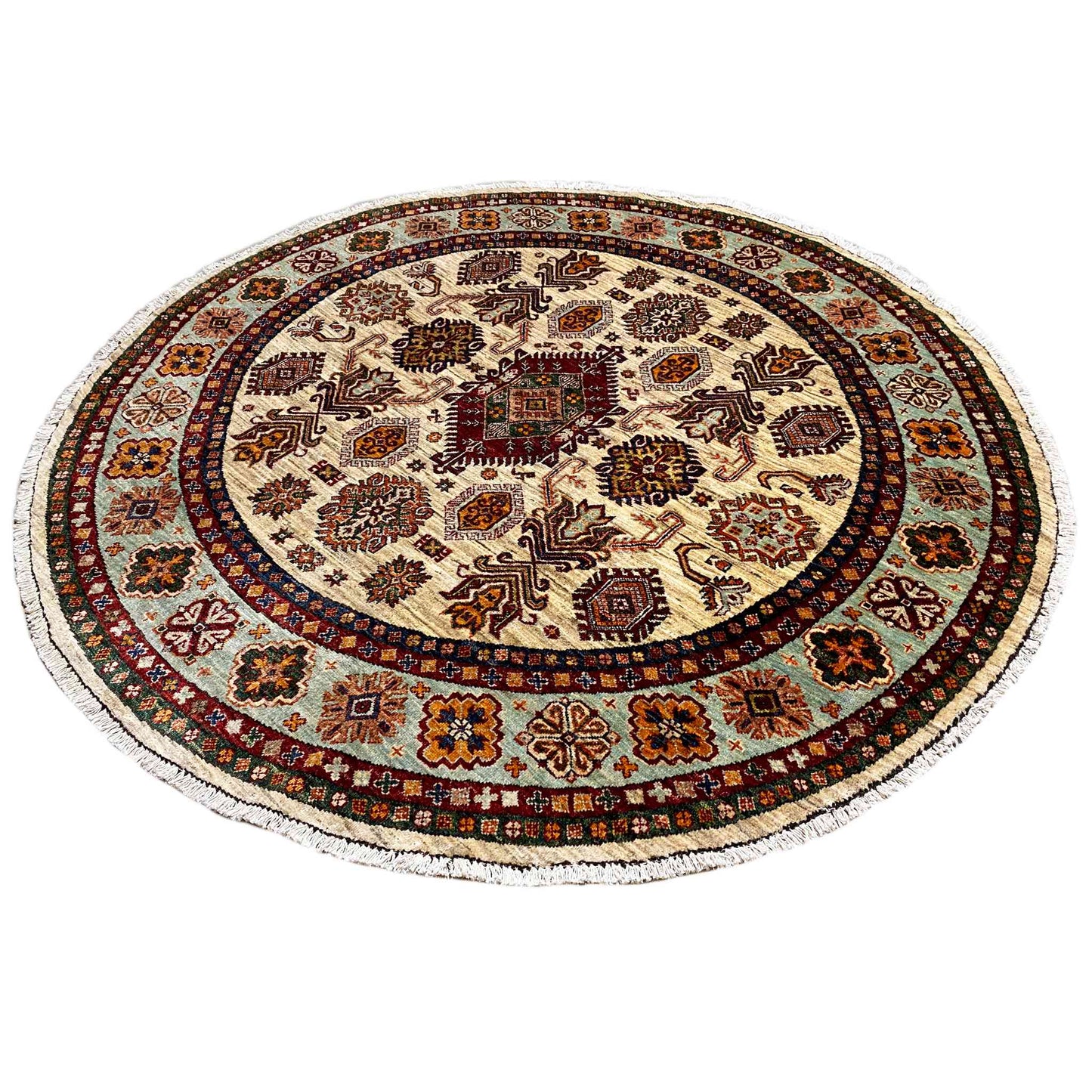 Round rug with a beige base, dark ornaments, and a red/brown border, densely woven
