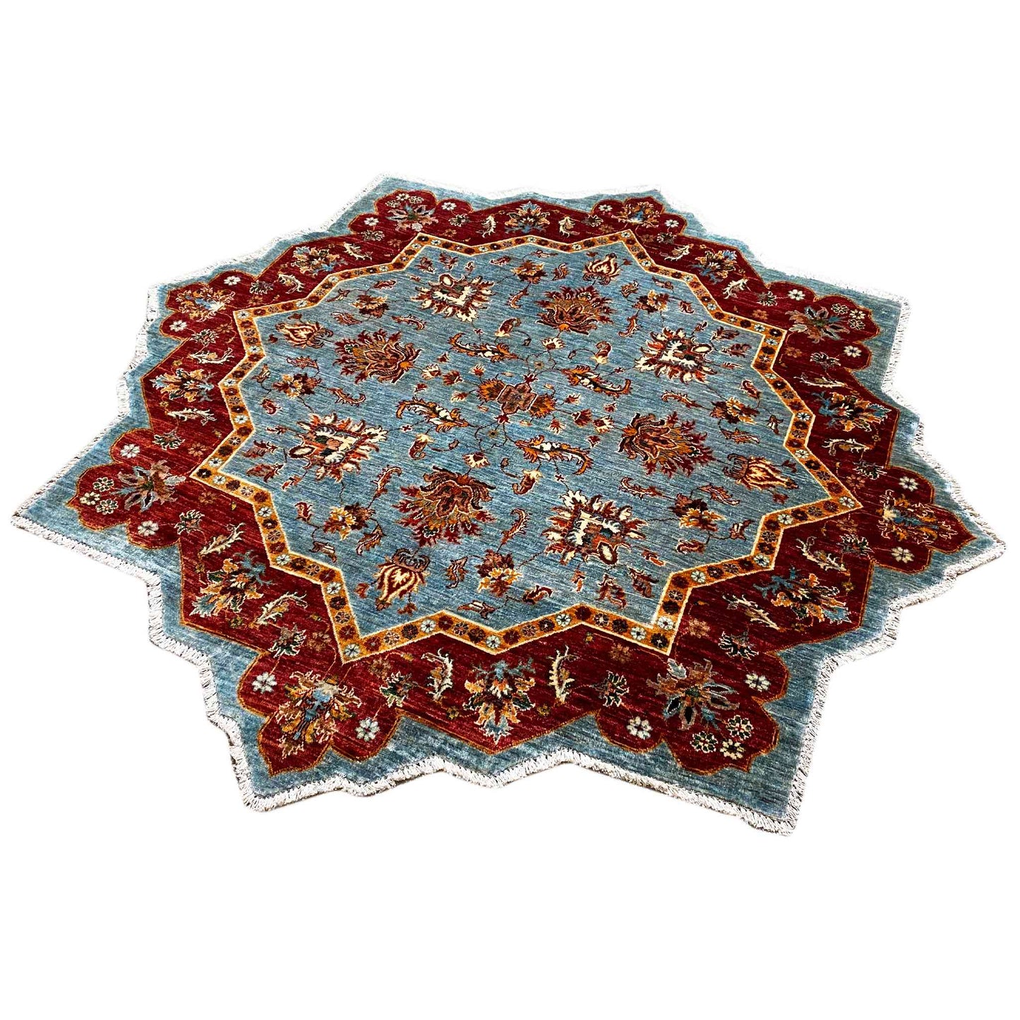 Rug with a star-shaped medallion in light blue and burgundy, decorated borders