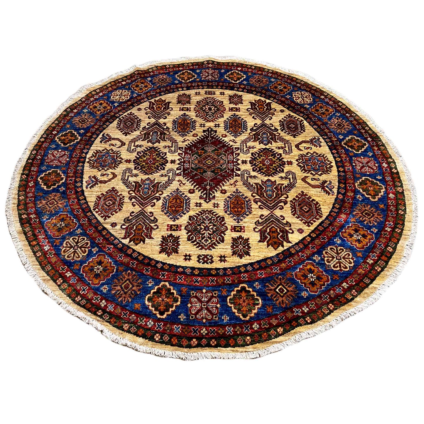 Round rug with beige ornamental design and blue decorative border around the edge