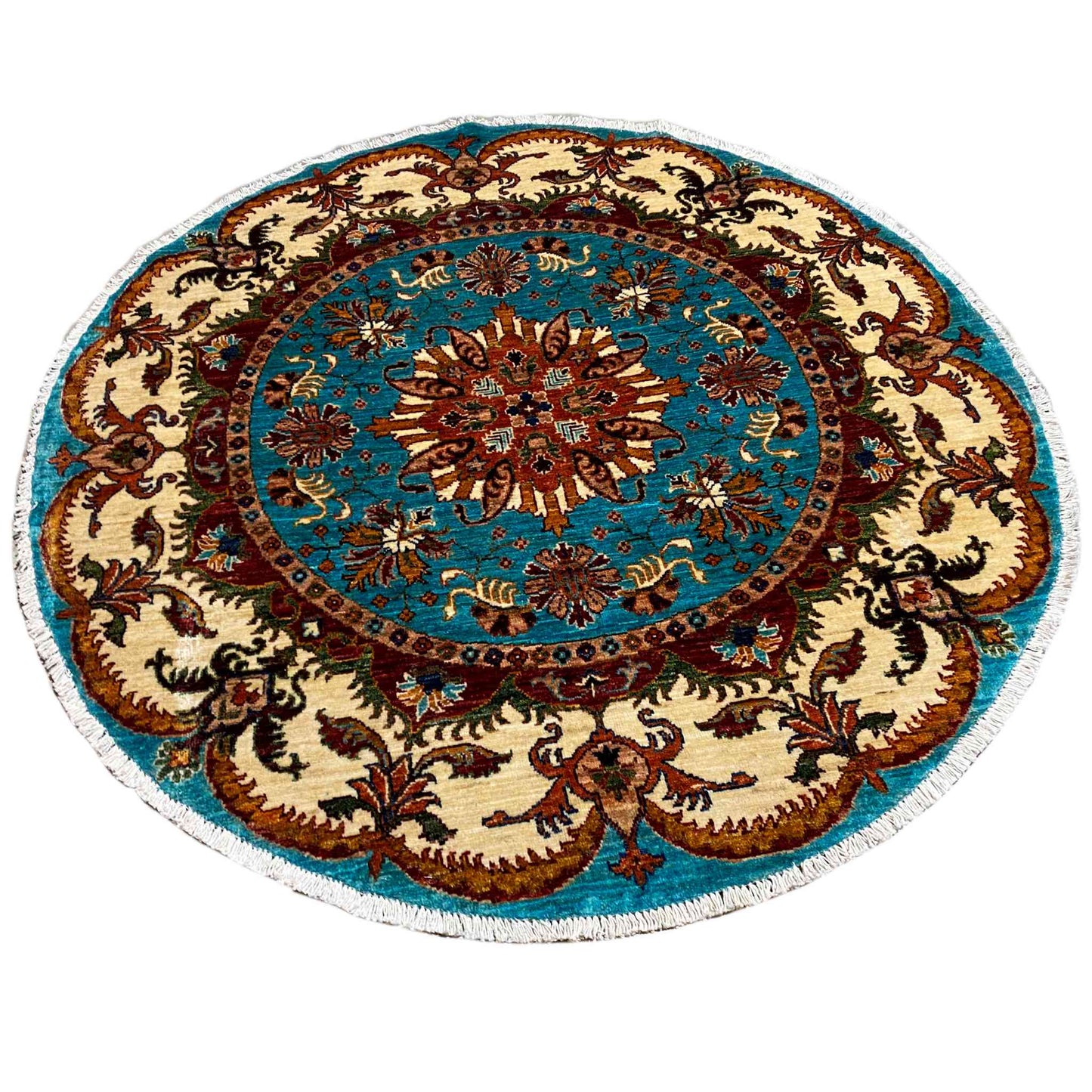 Round rug with a turquoise central motif and beige ornamental border, embroidered in color.