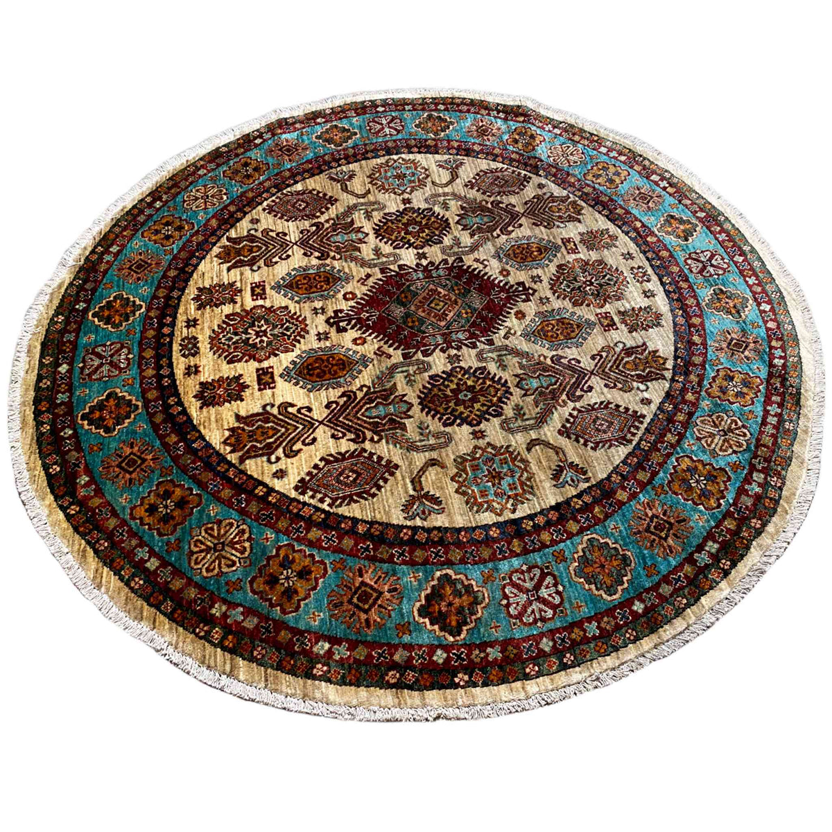Round rug with a cream-colored center, dark brown border, and turquoise accents