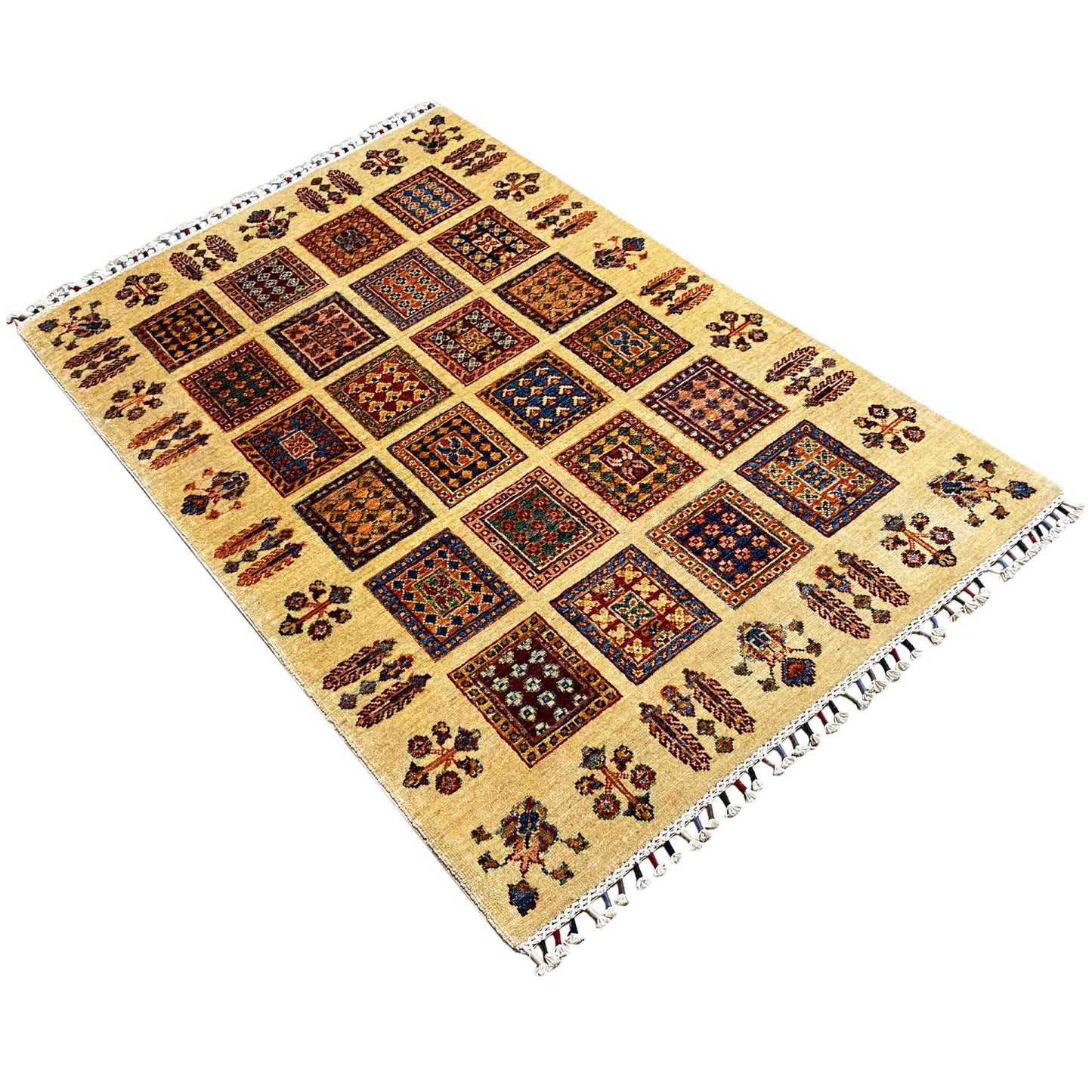 Beige Afghan Khorjin rug in diagonal view with a square ornamental grid and fringes