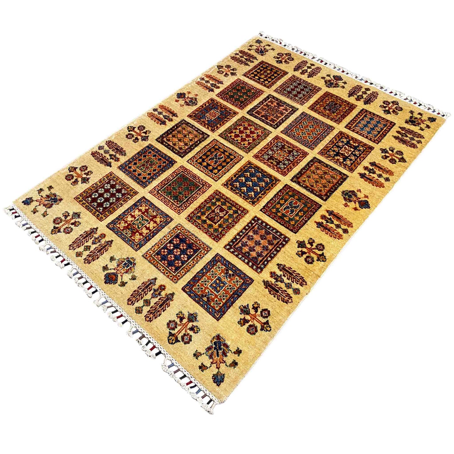 Beige Afghan khorjin rug shown at an angle, rows of square patterns with colorful motifs, fringes