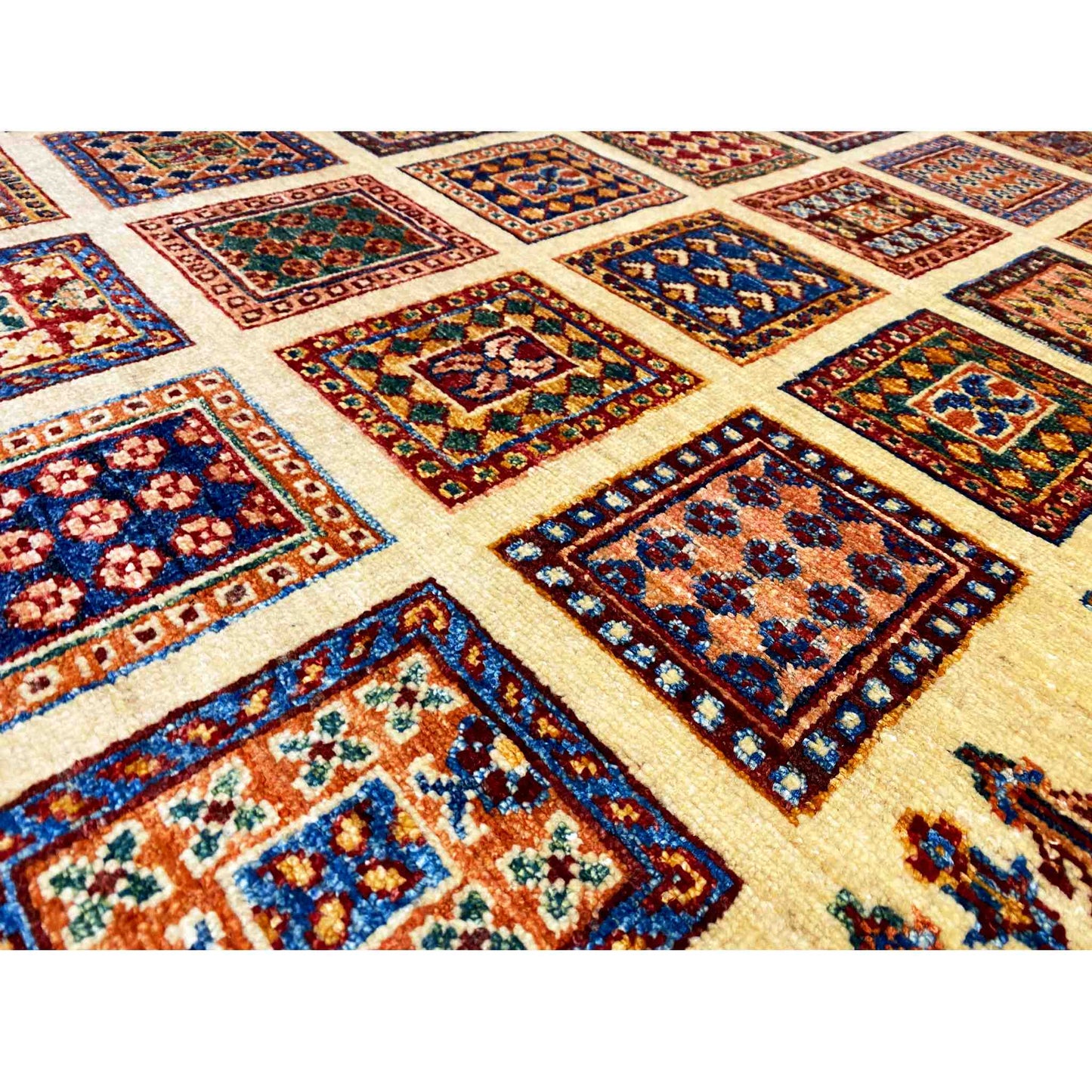 Detailed view of Afghan Khorjin rug: colorful tile motifs in a geometric diamond pattern