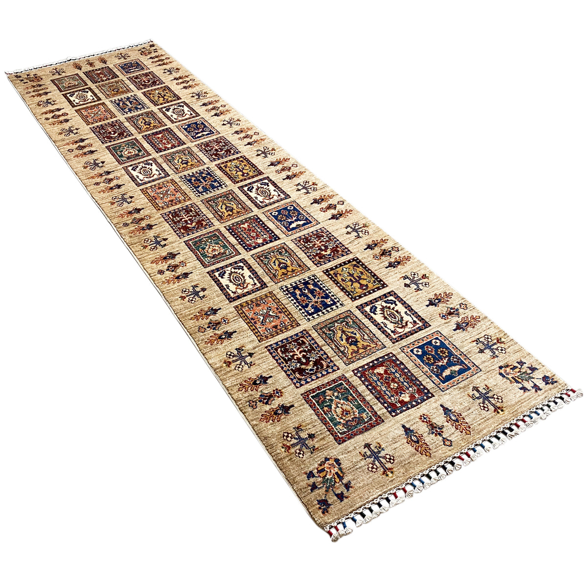 Hand-knotted Khorjin runner, diagonal view: beige background with patchwork diamonds
