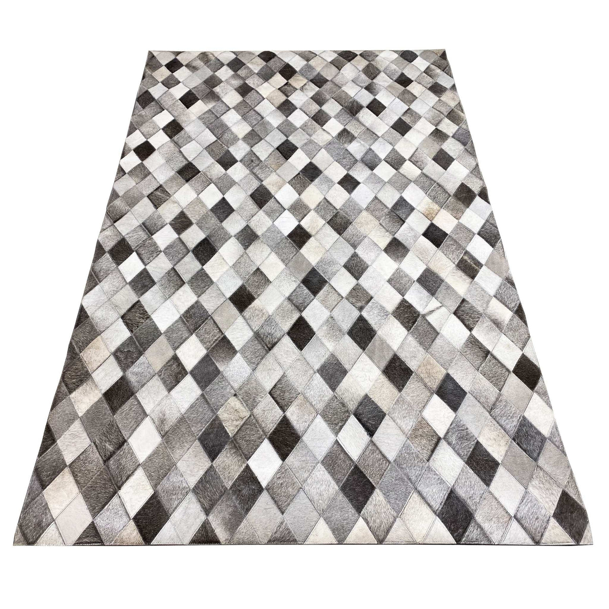 Calfskin rug with a diamond pattern: gray and white squares with black accents