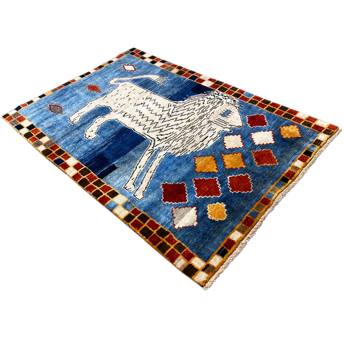 Blue Gabbeh rug with a white lion, colorful red and yellow diamonds, and a checkered border.