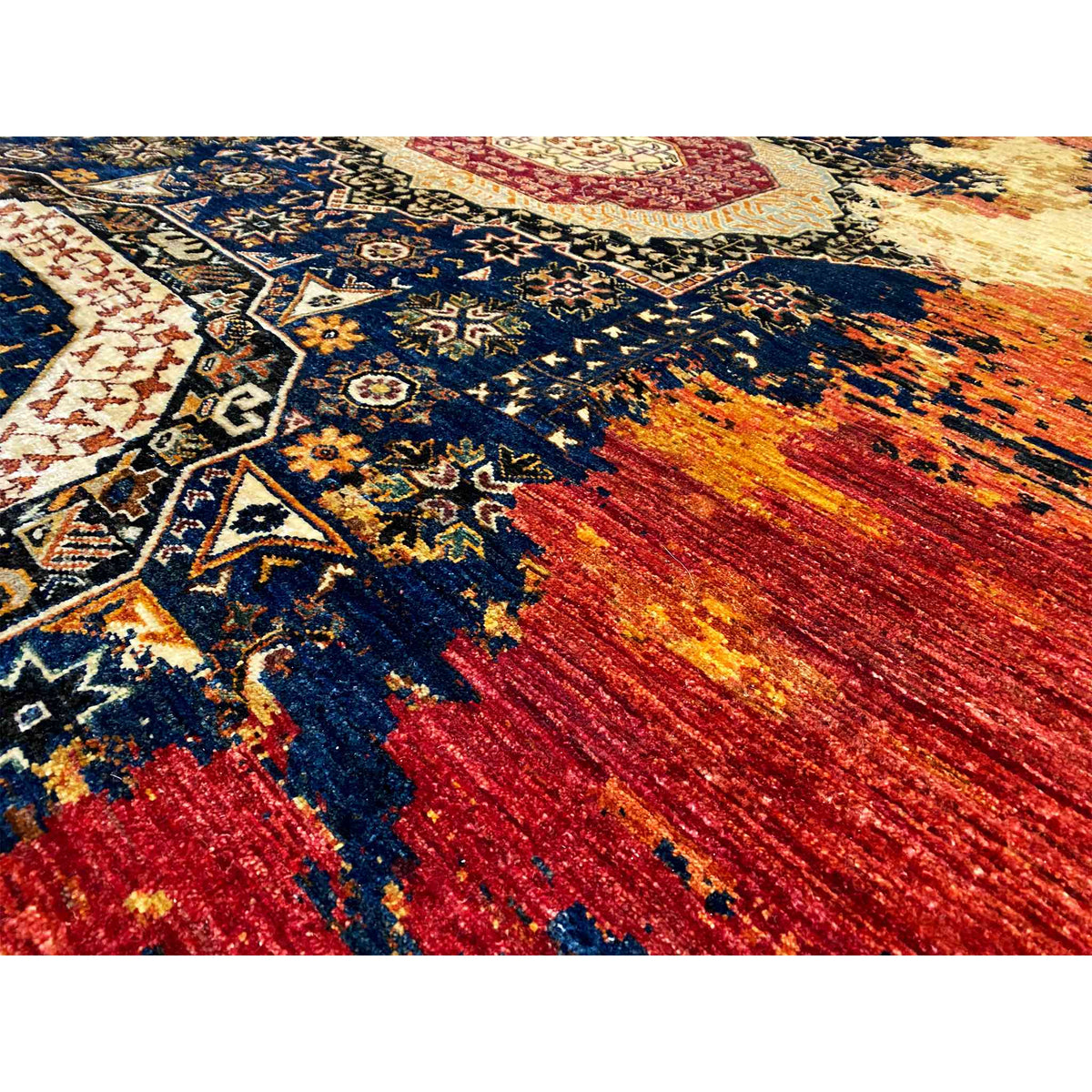 Mamluk wool carpet close-up: blue ornamental field with red and beige patches of color