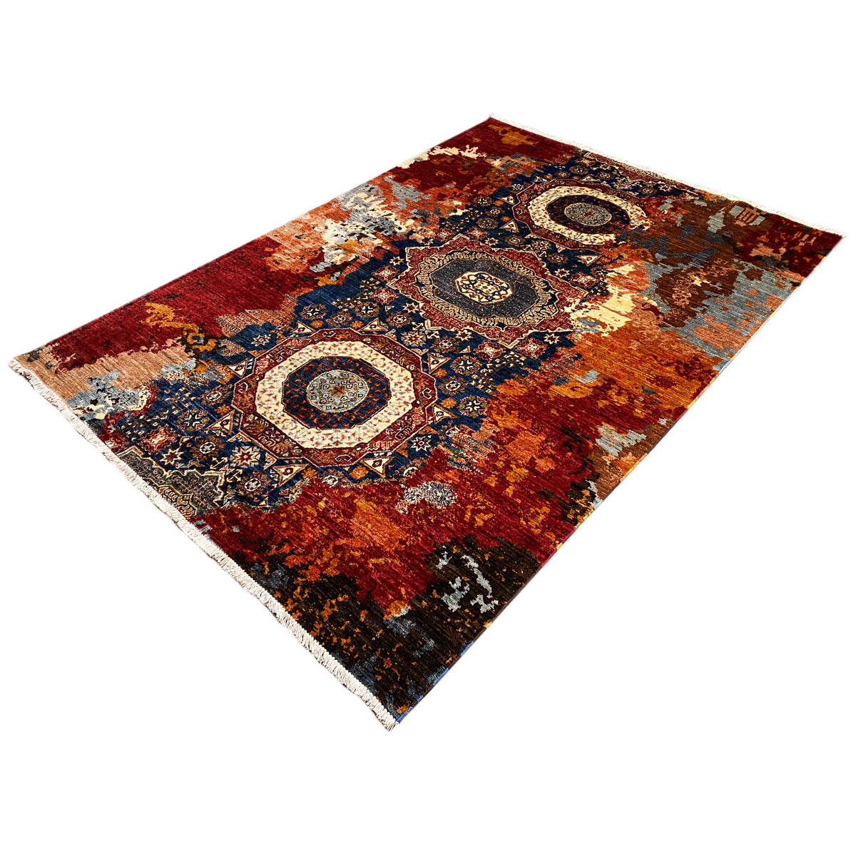 Hand-knotted Mamluk carpet with three central medallions and blue-red ornaments, angled.