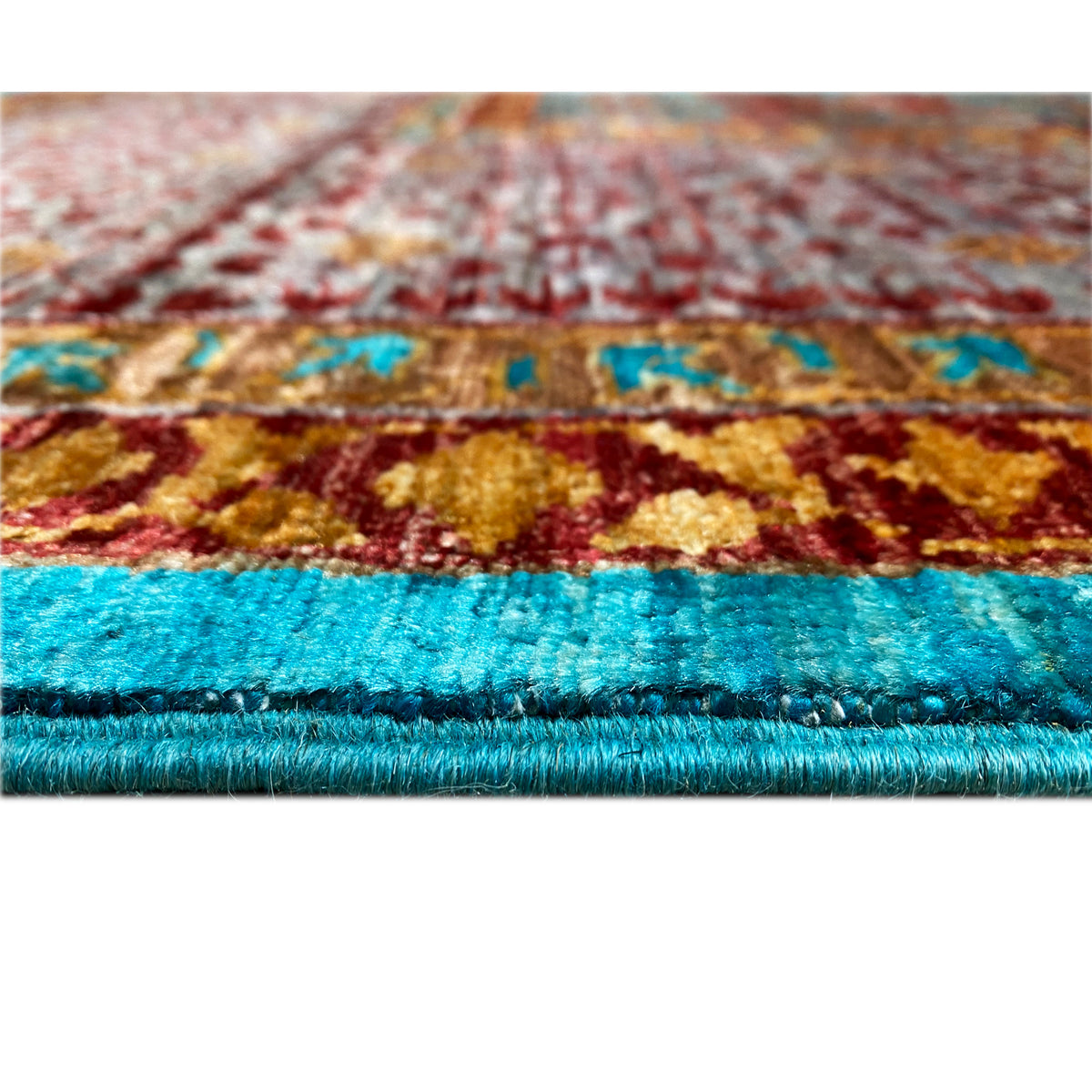 Hand-knotted rug, detail of the selvage with dense pile in turquoise and burgundy