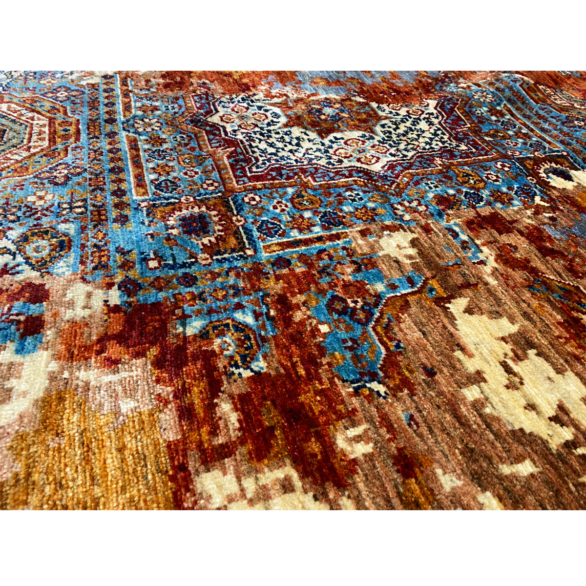 Close-up: carpet surface with fine blue and rust-brown ornaments