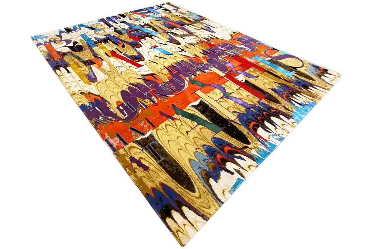 Corner view: designer rug with a colorful abstract pattern in yellow, blue, red, and purple