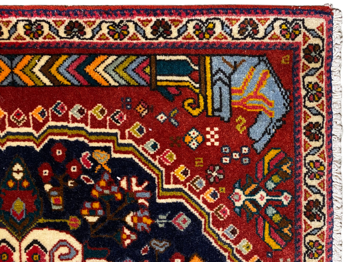 Poshti rug 65x61 cm edge detail: red field with a turquoise-gray motif and white border