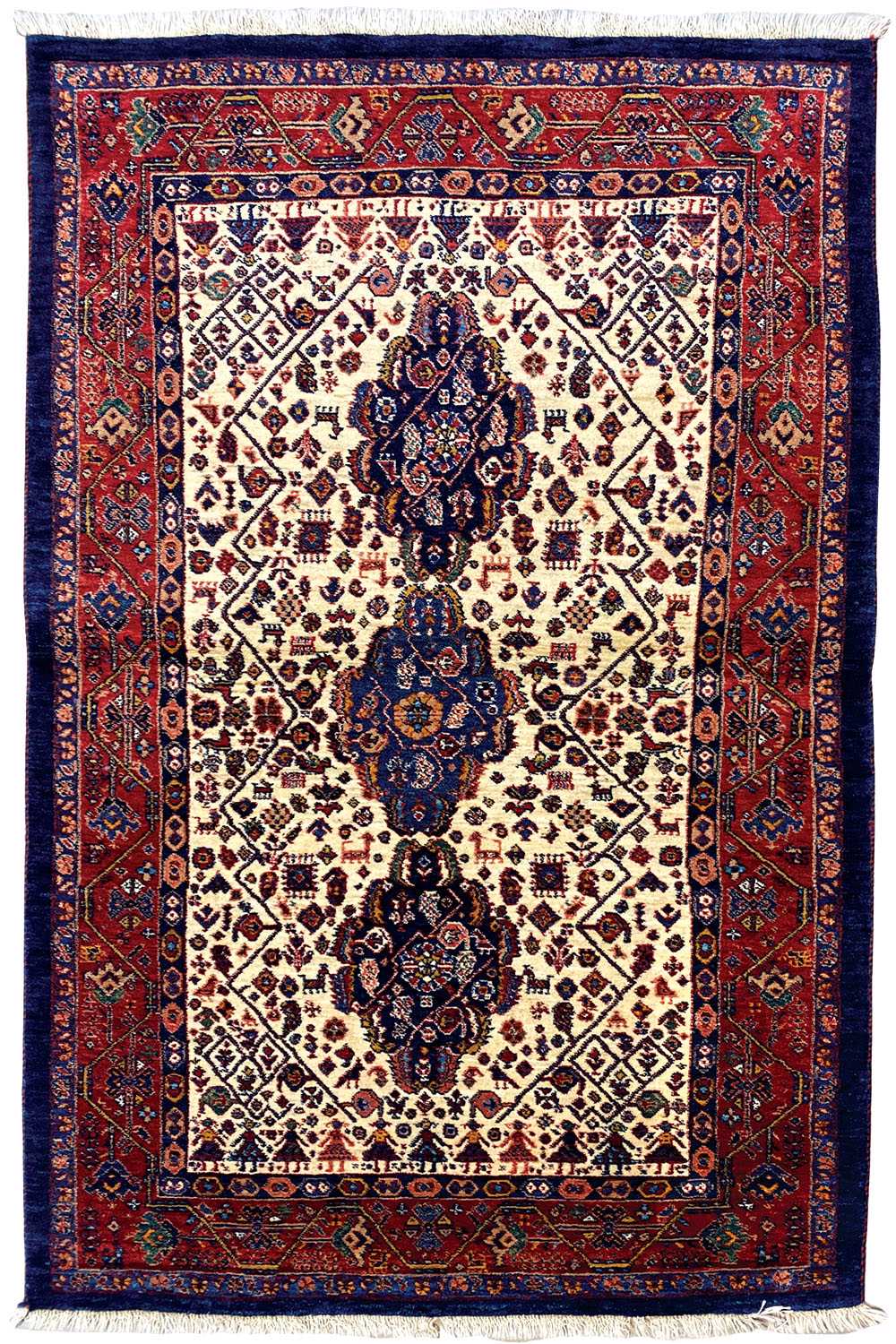 Qashqai rug with an all-around border, cream-colored field, and dark blue center field