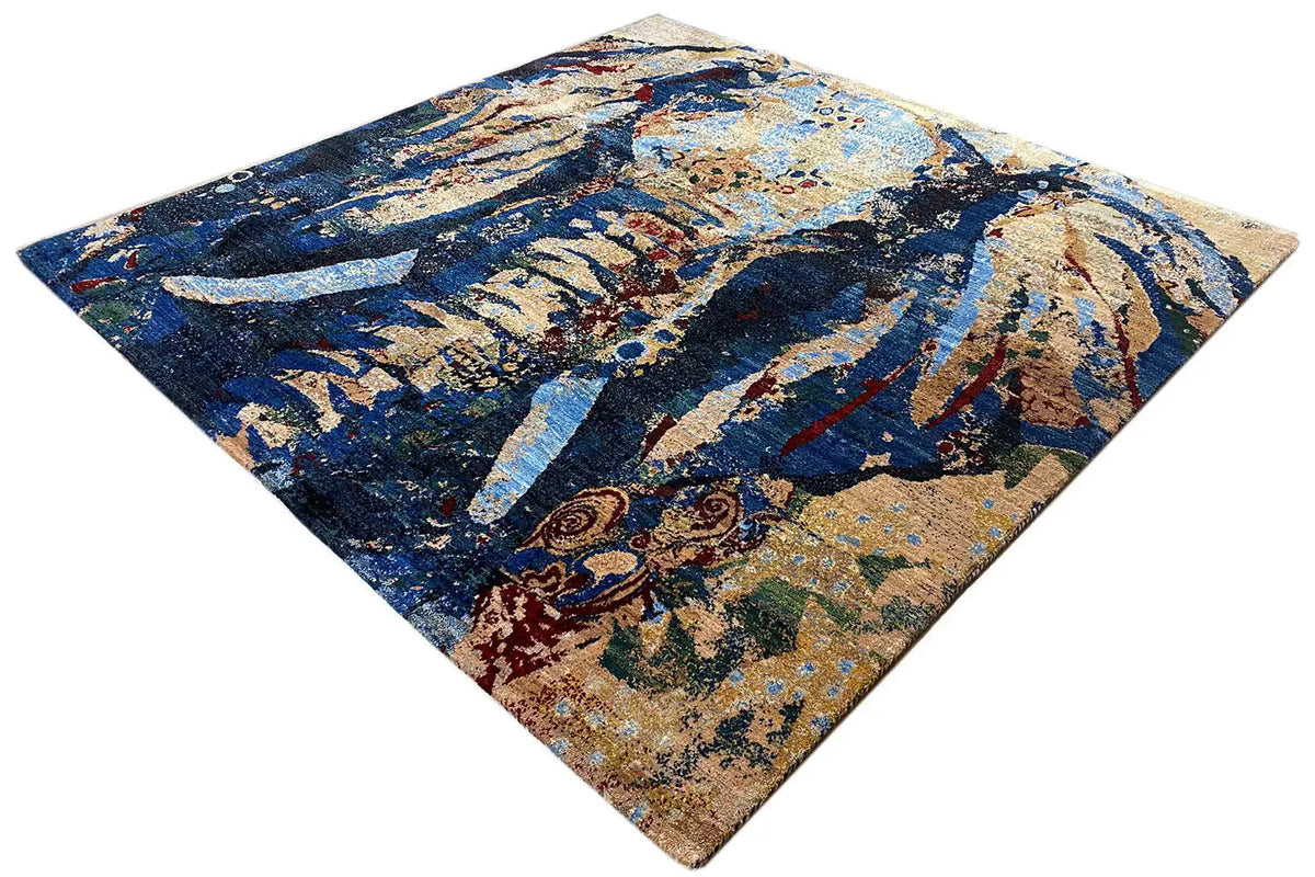 Gabbeh Lori rug with an abstract blue-and-gold figurative pattern, giving the appearance of being folded