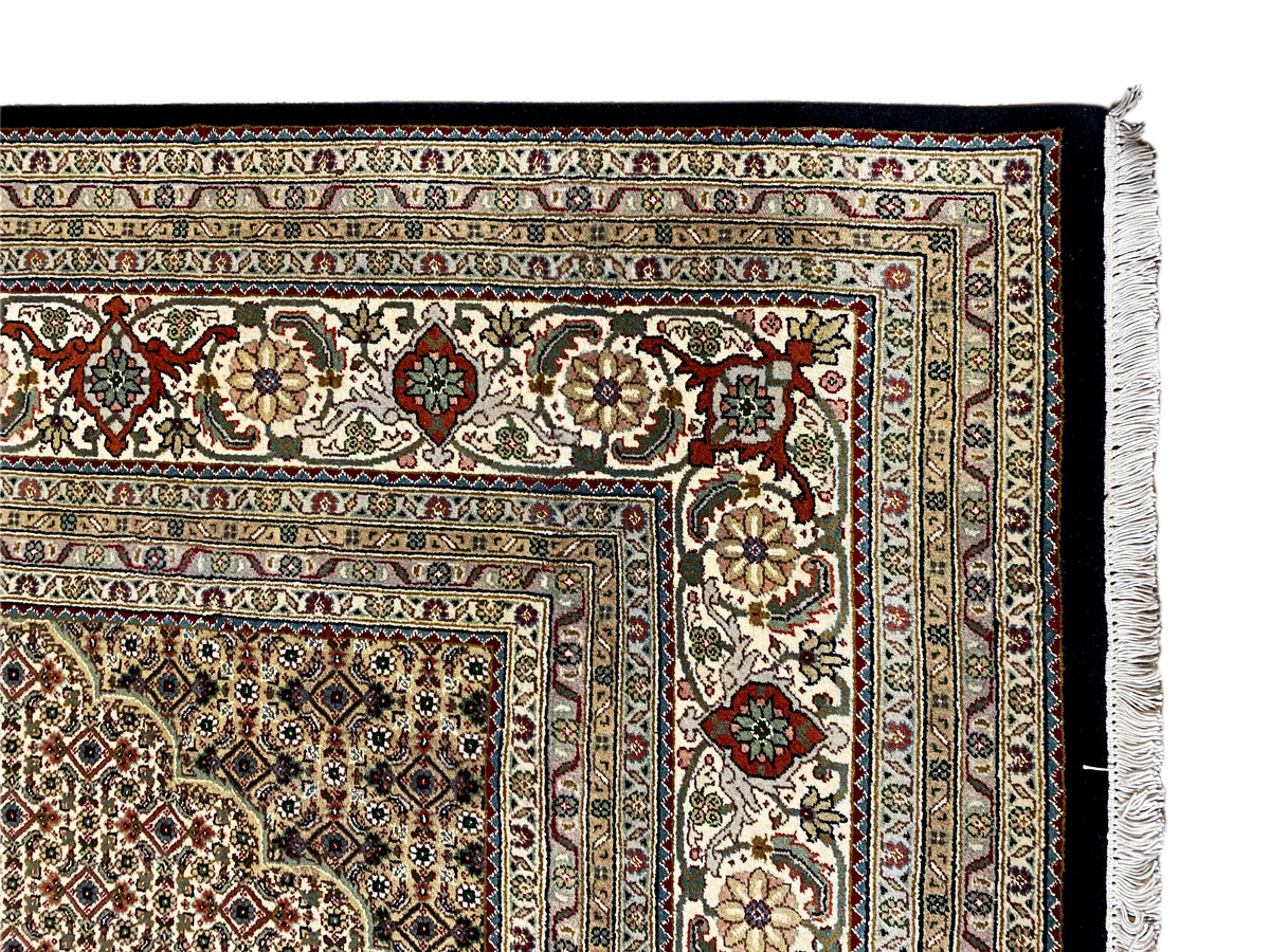 Brown Tabriz rug with finely patterned border design, close-up of the edge