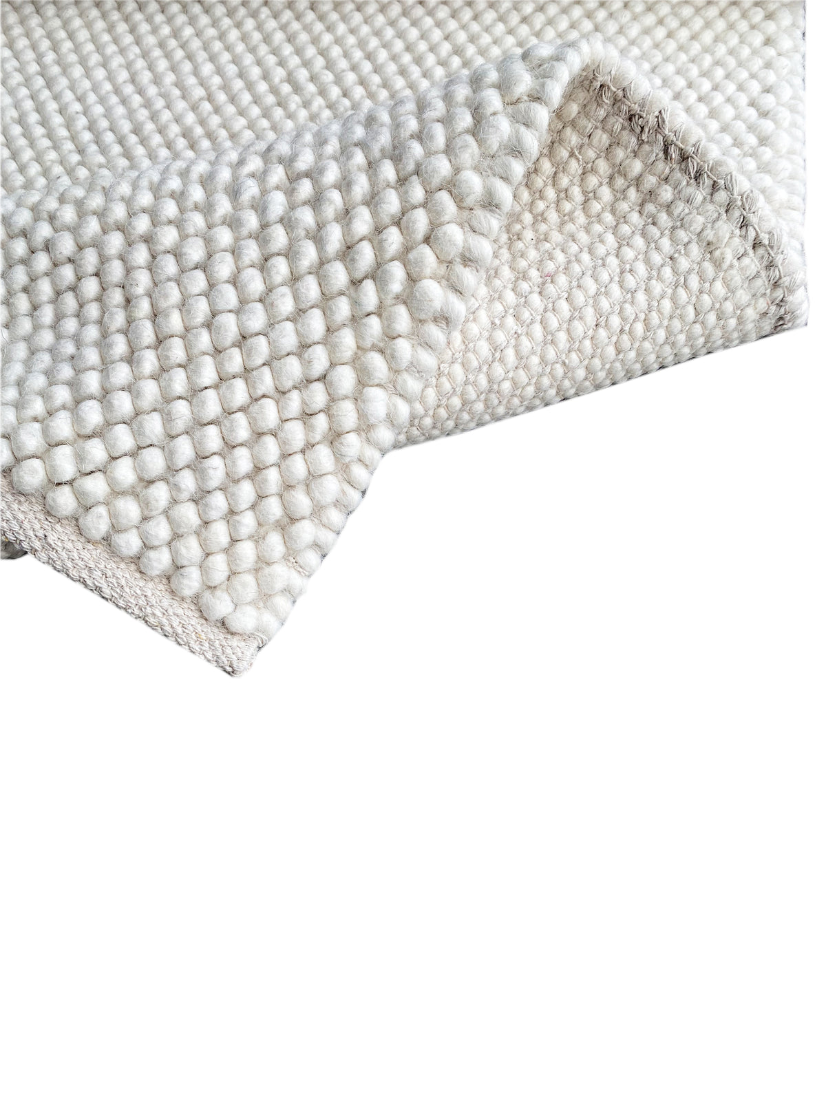 Cream-white loop-pile rug, rectangular edge with a fringed look