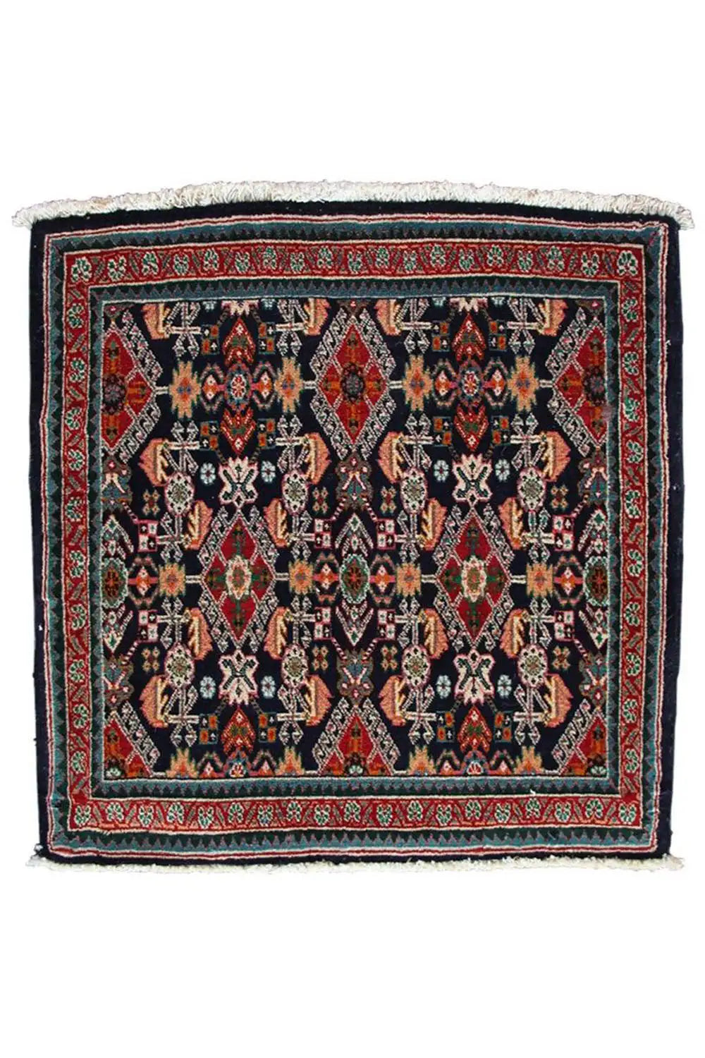 Square oriental rug, dark blue background with a red border and white fringes