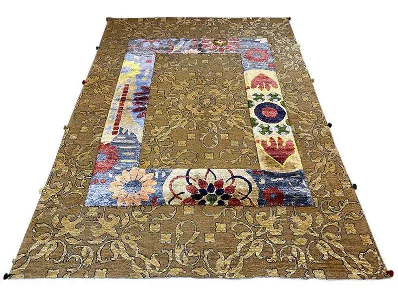 Large designer rug: golden brown, patchwork motifs in blue, red, and yellow