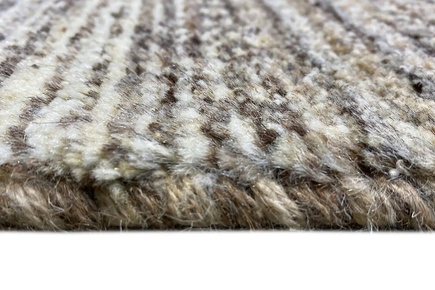 Gabbeh rug detail: short pile, beige-gray with dark knots and stripes