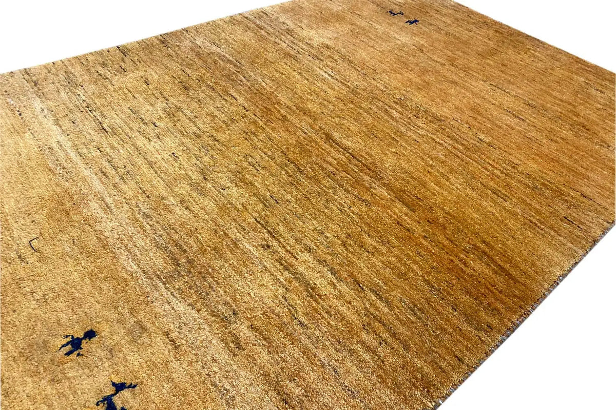 Gabbeh rug (153x97 cm) close-up: short pile, ochre brown, dark motifs