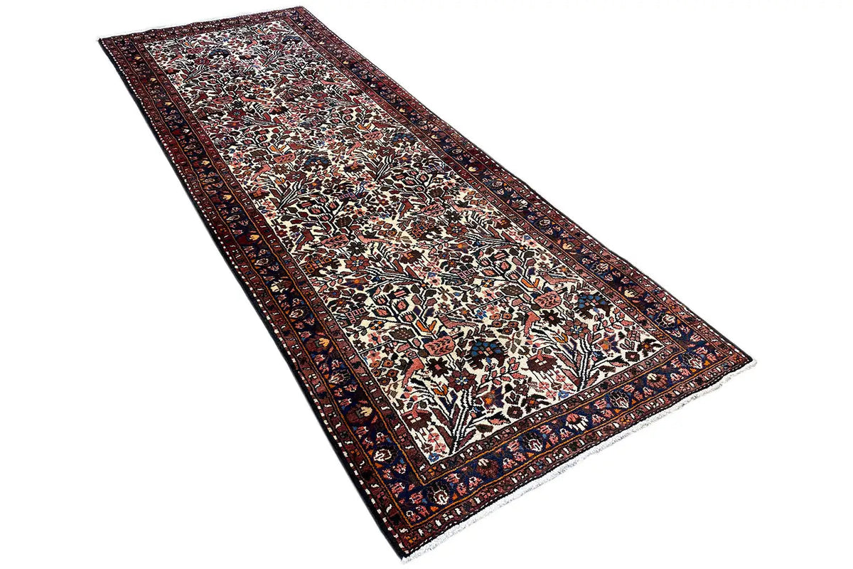 Flat-spread runner rug: intricate ornamental pattern on a dark background