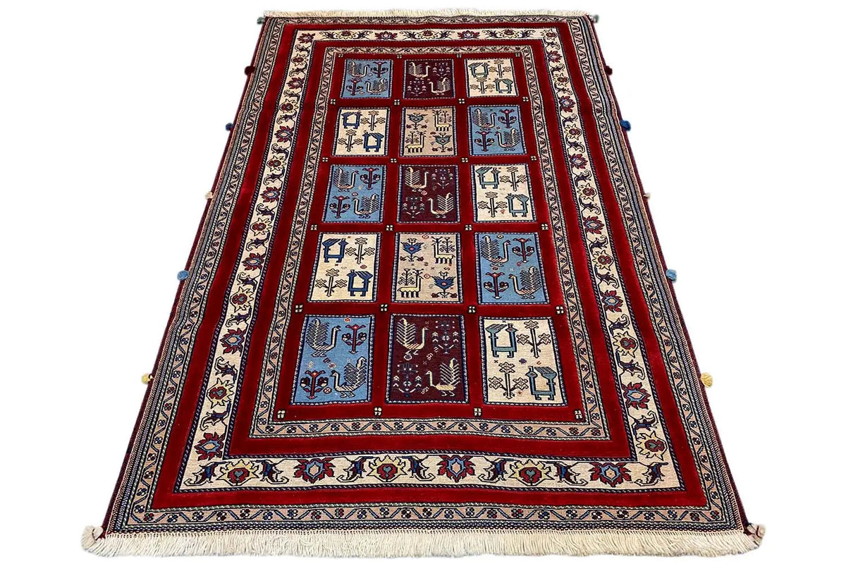 Carpet with a red central field, multi-row border in blue and beige, fringes