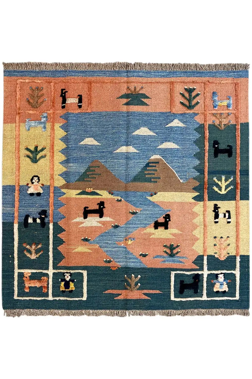 Kilim rug with a geometric central motif, blue and rust-brown border, fringes