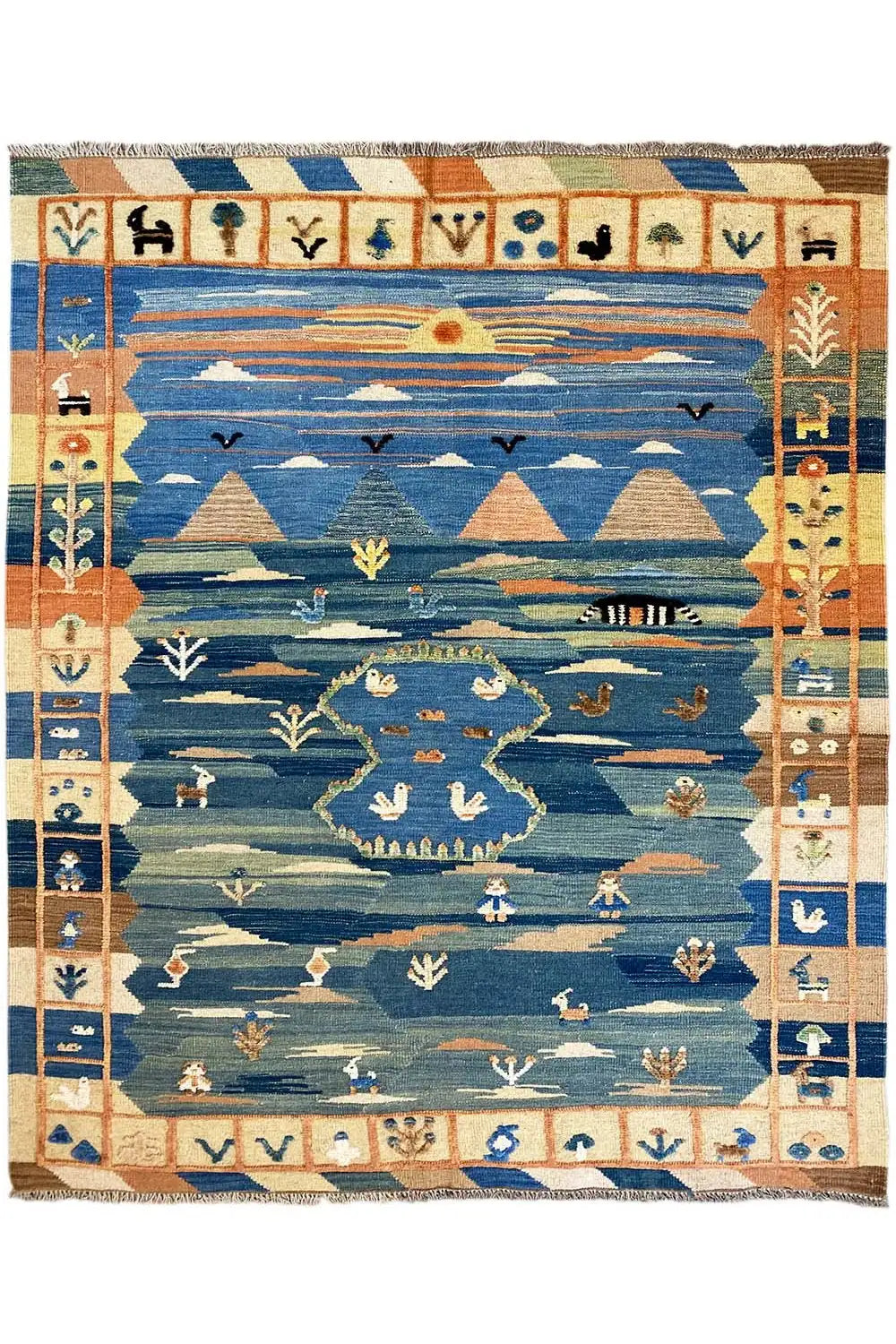 Kilim rug in a square design: blue with rows of beige-brown symbols