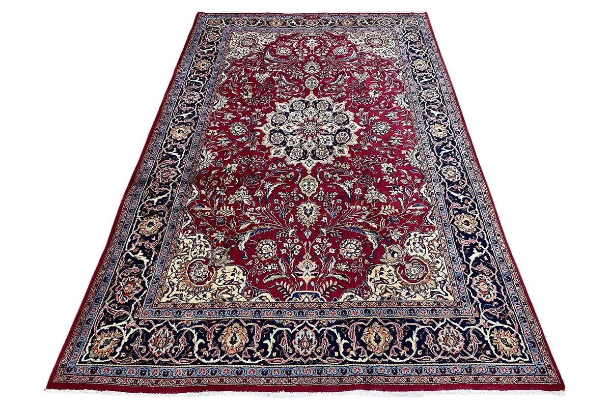 Khorasan rug, rectangular: red pattern with central medallion and decorative border.