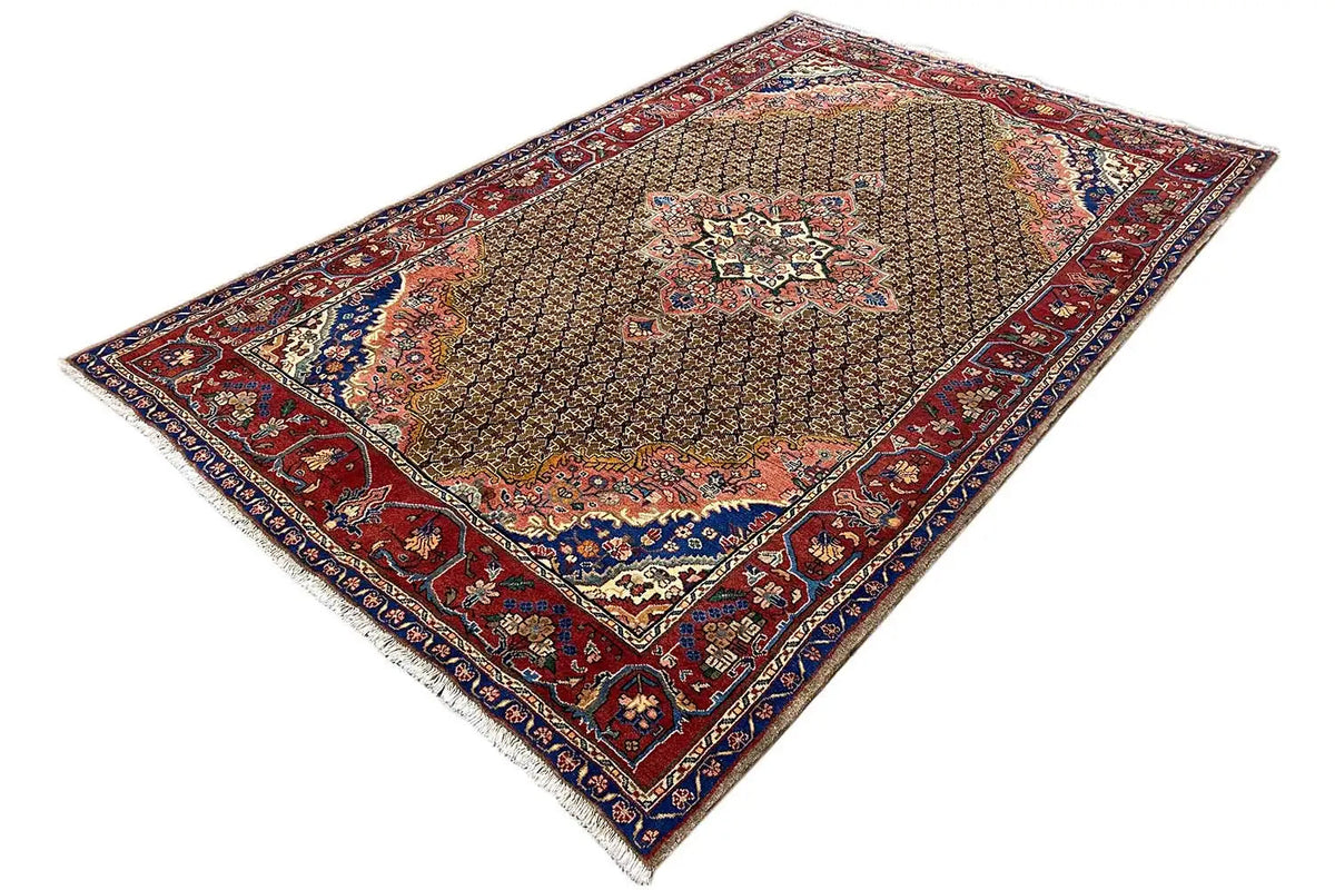 Hamadan rug with a red border, blue decorative frame, and central medallion on a brown background