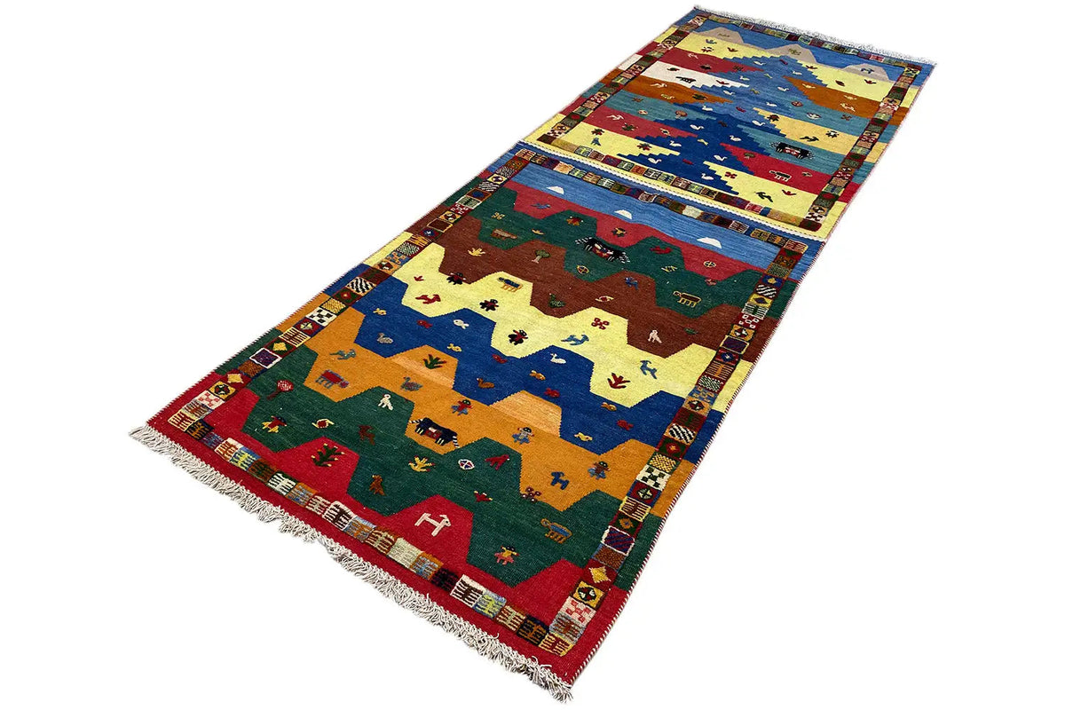 Rectangular kilim runner with colorful animal motifs and an ornamental border, fringes