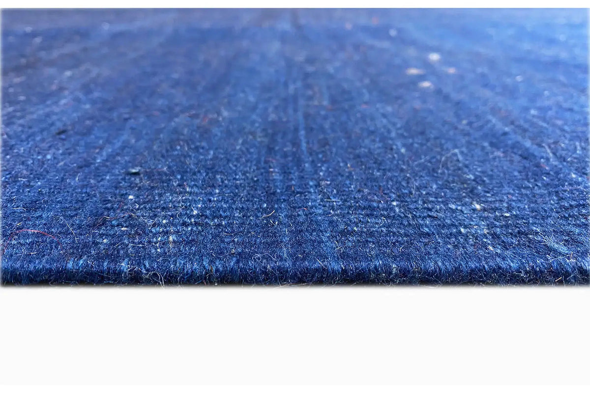 Blue kilim rug, richly detailed surface with fine inclusions and texture