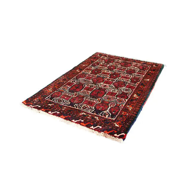 Oriental rug with a red background, colorful border ornaments, and visible weave texture