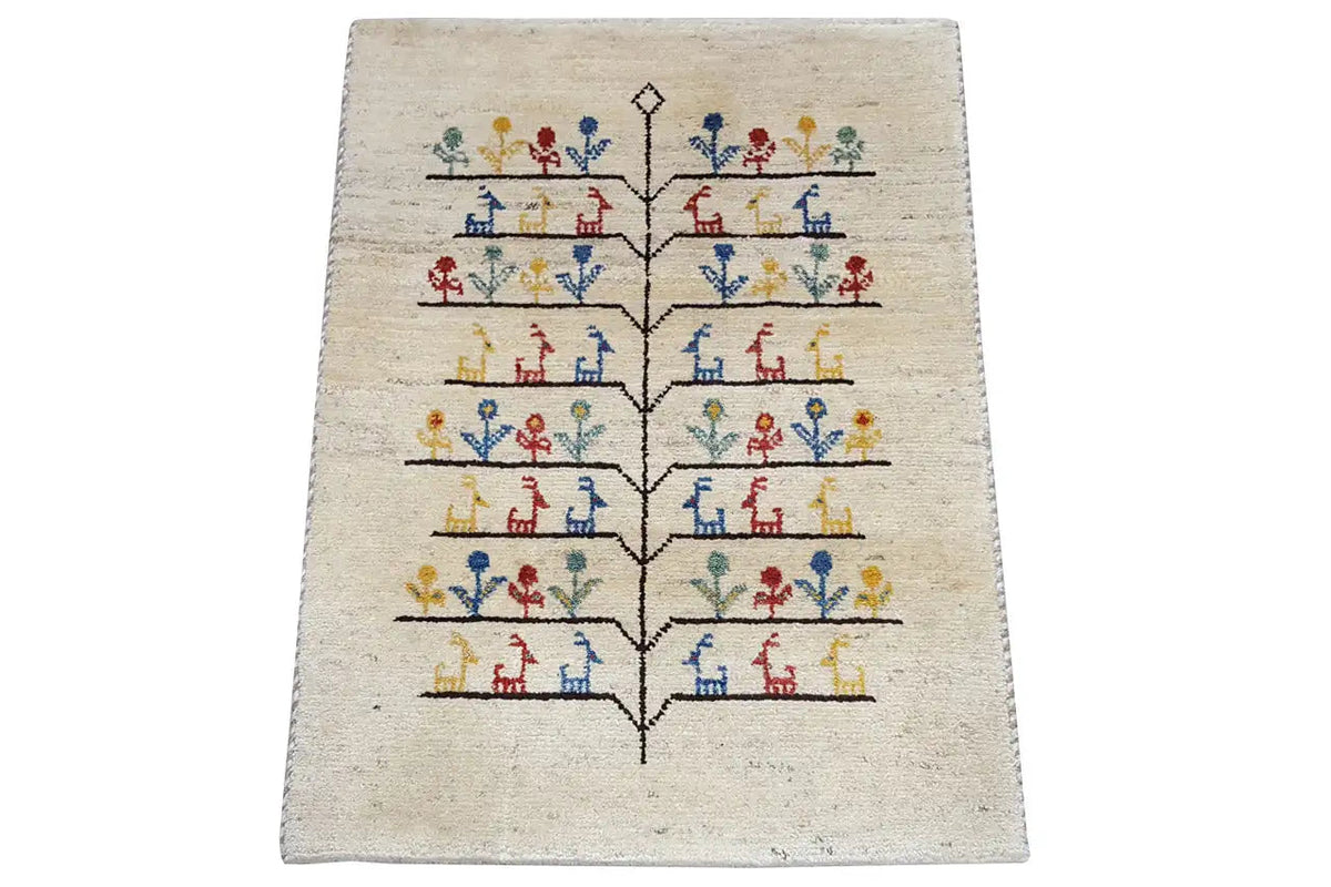 Gabbeh rug 88x60 cm with centered tree pattern and colorful figures on cream background