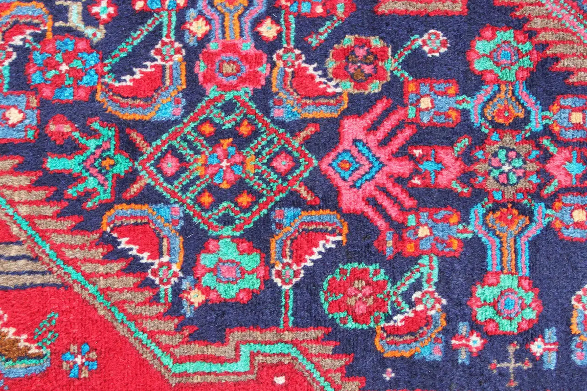 Detailed view: floral and geometric ornaments in red, blue, green, and turquoise