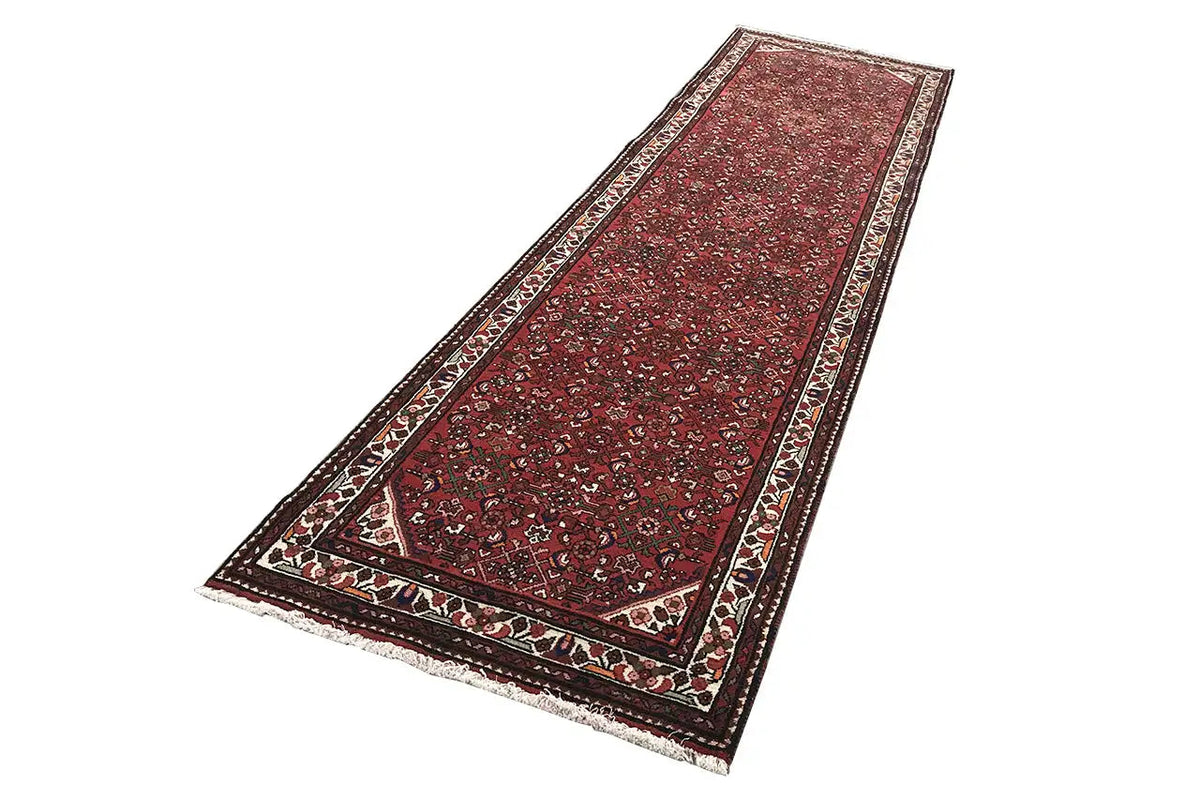 Red Hamadan runner with borders, a fine ornamental pattern, and contrasting edges